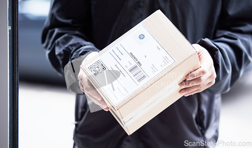 Image of Box, hands and courier at with mail for a delivery, ecommerce work or cargo shipping. Closeup, logistics and man or person with package, stock or front door freight wholesale or distribution service