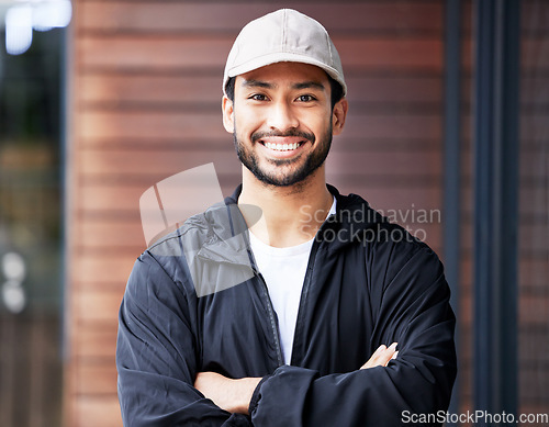 Image of Arms crossed, portrait and asian man courier outdoor for delivery and service with a smile. Face, proud and happy Japanese male carrier ready for ecommerce, order or logistics, mail or distribution