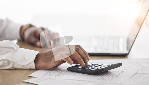 Image of Person, hands and calculator, computer and documents for financial planning, taxes management and business debt. Accountant typing numbers for budget, bookkeeping math and audit paperwork on laptop