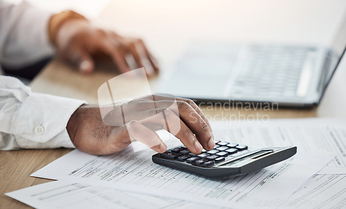 Image of Person hands, calculator and computer with documents for financial planning, taxes management or business debt. Accountant on laptop, paperwork and math or numbers of startup budget, profit or goals