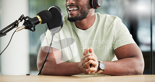 Image of Black man, speaker and microphone, radio DJ with headphones, news communication and audio equipment. Podcast, technology and multimedia with male presenter, mouth, talk show with press and broadcast