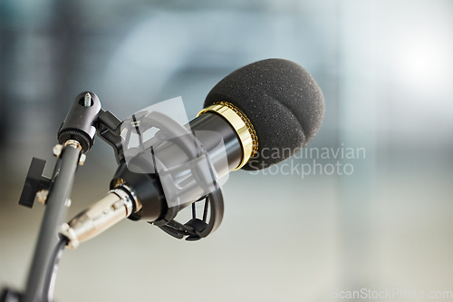 Image of Background, closeup and microphone for podcast, radio interview and audio in recording studio. Sound gear, voice over production and broadcast of talk show, live stream communication and music media