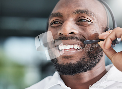 Image of Call center, black man and happy consultant in office or speaking in workplace for customer service, crm or communication. Businessman, talking and contact us for support, advice or help desk