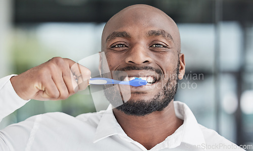 Image of Black man, portrait and brushing teeth with toothbrush, dental and health, hygiene and grooming. African male person, face and toothpaste with oral care, orthodontics and routine with fresh breath