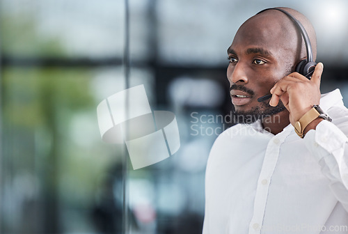 Image of Black man, call center and thinking of solution for customer service, advisory help and FAQ questions. Serious salesman working in CRM agency for telecom consulting, tech support and communication
