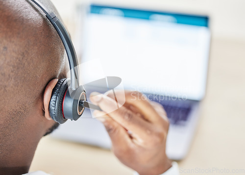 Image of Man, consultant and laptop for call center communication, headphones and online customer services or IT support. Back of person or agent on computer screen for virtual help and information technology