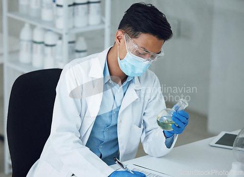 Image of Science, laboratory and man with chemical for doctor research and study in clinic. Lab notes, liquid analysis and healthcare professional with innovation and solution for virus test of scientist