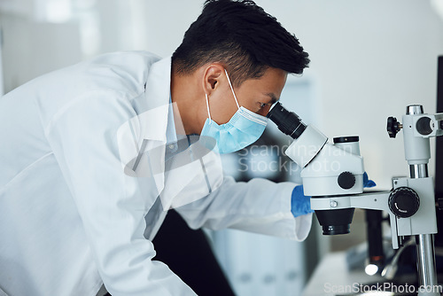 Image of Microscope, science and asian man with face mask in laboratory for research, medical analysis and biotechnology. Scientist, microbiology and investigation of innovation, dna testing and development