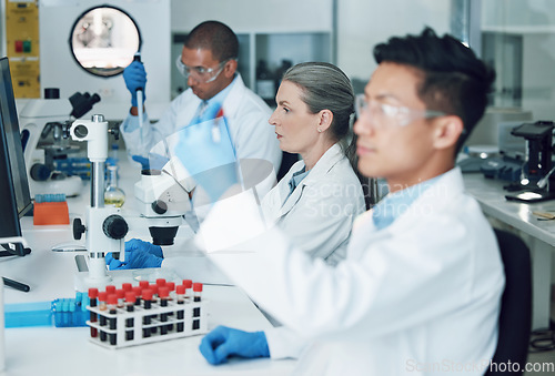 Image of Science, laboratory and team with blood work for doctor research and study in clinic. Lab, analysis and healthcare professional with innovation and investigation for covid test of dna scientist