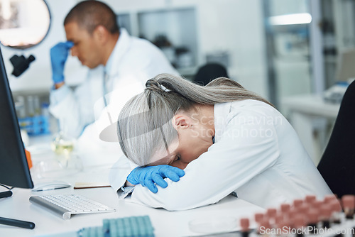 Image of Science, sleeping woman and lab scientist with burnout, mental health anxiety or depression, medical crisis or fatigue. Laboratory, exhausted and person tired after mistake, overtime work or tension