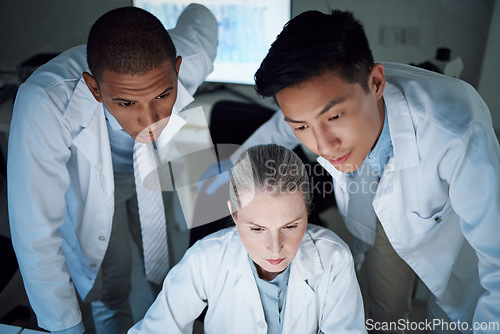 Image of Scientist group, thinking together and analysis in laboratory, night and teamwork for innovation, diversity and overtime. Men, leader and woman in science team, brainstorming and ideas in dark lab