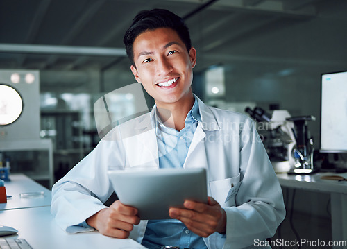 Image of Tablet, portrait and scientist with digital innovation, data and smile in laboratory. Asian man, doctor and information technology for futuristic medical research with online pharma healthcare study