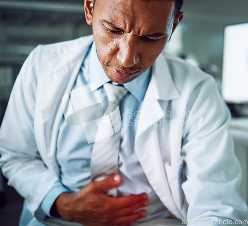 Image of Scientist man, lab and stomach ache with health, stress or anxiety in night for pain, gas or red glow overlay. Science worker, constipation or digestion problem with hand on abdomen in laboratory