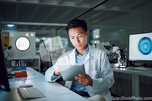 Image of Tablet, planning and scientist with digital innovation, data and reading in laboratory. Asian man, doctor and information technology for futuristic medical research with pharma healthcare study