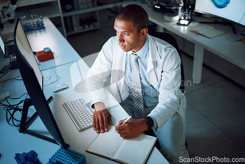 Image of Doctor, writing and night with computer in laboratory for medical research and study with healthcare. Paperwork, male professional and planning with data for biotechnology in clinic or hospital