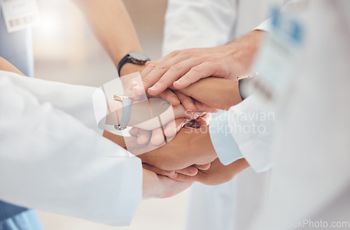 Image of Hands together, team and collaboration with doctors and support, healthcare service and solidarity at hospital. Group of people, meeting and teamwork with health mission, innovation and strategy