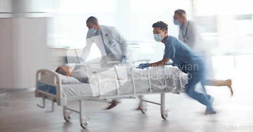 Image of Doctors, team and rush with bed in hospital for healthcare emergency, surgery operation and first aid help. Medical group running fast with motion blur for patient urgent service assessment in clinic