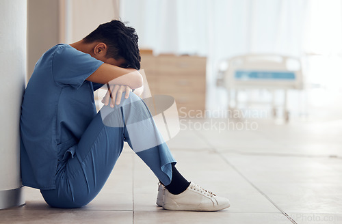 Image of Healthcare, man on the floor and stress with depression, employee and panic attack with burnout. Person, medical professional and sad doctor with mental health problem and surgery fail in a hospital