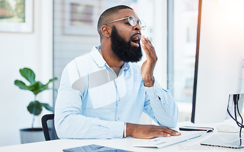 Image of Yawn, tired employee and black man at desk, burnout and agent with startup company, feeling exhausted and computer. Fatigue, early morning and consultant working on pc with overtime, tech and sleepy