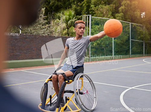 Image of Basketball, wheelchair and man with sports ball at outdoor court for fitness, training and cardio. Exercise and person with a disability at a park for game, workout and weekend fun or active match