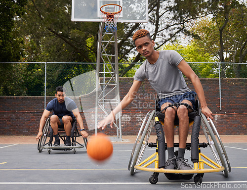 Image of Sports action, wheelchair basketball or man focus on match competition, outdoor court challenge or fitness. Determined player, dribbling ball or African athlete with disability, training and exercise