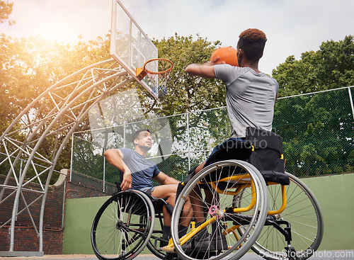 Image of Wheelchair basketball player, shot and sports people play match competition, challenge or practice game skills, target or goal. Outdoor court, shooting workout and athlete with disability, training