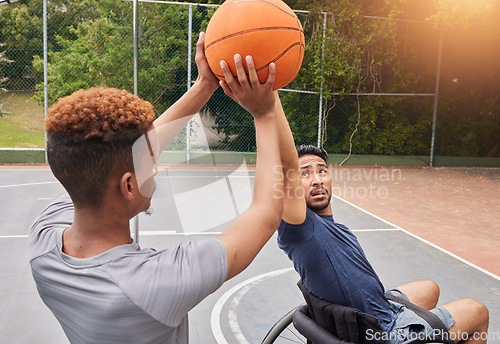 Image of Sports player, wheelchair basketball or people shooting, defence and practice target, goal and aim ball. Outdoor training, athlete competition or player workout, court fitness and men with disability