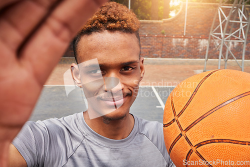 Image of African man, basketball player and portrait selfie on court for social media, fitness blog or training match vlog. Face, pov or athlete with ball for exercise, workout and sports photography in games