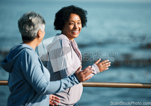 Image of Running, fitness and senior women at beach happy, wellness and exercise in nature together. Elderly, friends and ladies at sea smile, workout and active retirement, fun or laugh, bond and ocean run