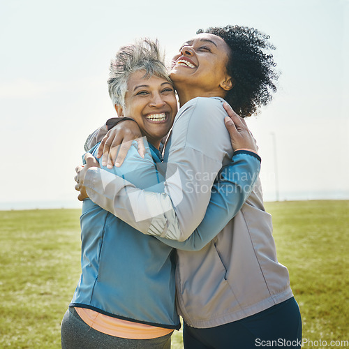 Image of Hugging, fitness and senior women bonding together in an outdoor park after a workout or exercise. Happy, smile and elderly female friends or athletes with love and care after training in nature.