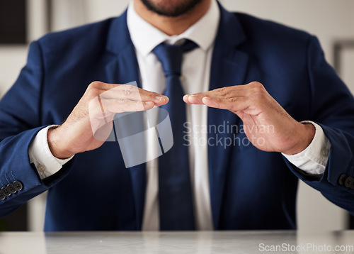 Image of Hands, insurance and a business man in the office closeup to offer cover for security or safety. Finance, support and hand gesture with a male employee working in an investment agency for protection