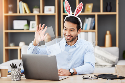 Image of Easter bunny, ears and man on online meeting at home with computer screen and greeting. Remote work, holiday and rabbit costume in virtual call in house for digital education class with male teacher