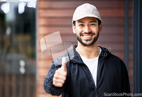 Image of Portrait, asian man and courier with thumbs up outdoor for delivery, success and thank you with a smile. Happy, face and Japanese guy supplier with emoji vote or yes feedback for distribution service