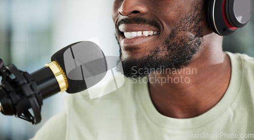 Image of Microphone, headphones and man on podcast, closeup and media broadcast with web radio host. Live streaming, happy influencer or content creator with mic, internet recording and face with technology