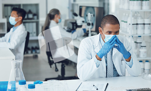Image of Lab, stress and scientist thinking of research in a laboratory worried to fail, mistake and problem with face mask. Error, anxiety and man with fatigue due to medical or healthcare development
