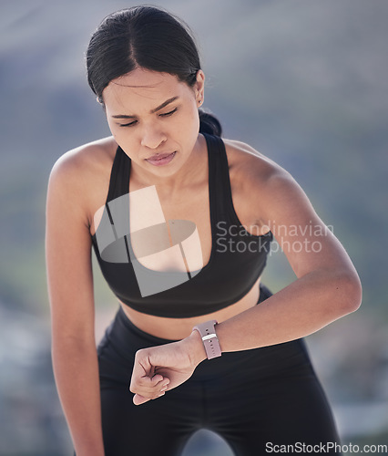 Image of Running, woman and check smart watch outdoor for time, heart rate and fitness. Sports runner, workout and clock on stopwatch tech for performance app, exercise progress and results of cardio training