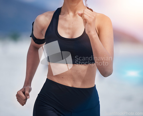 Image of Running, body and woman at a beach for fitness, training and performance, health and workout on blurred background. Sports, wellness and female runner at sea for resilience, challenge or ocean run