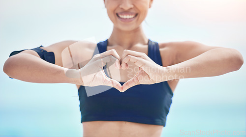 Image of Heart, hands and fitness of sports woman outdoor for freedom, wellness and healthy review. Closeup of happy athlete show finger shape for love, support and motivation for care, emoji sign and icon