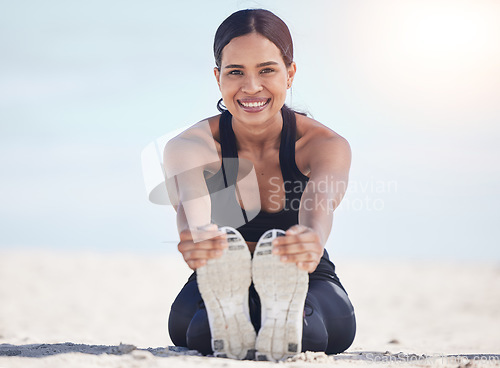 Image of Beach, fitness and woman portrait stretching feet in nature for running, workout or body, exercise or wellness. Shoes, stretch and face of female runner at the sea for training, sports or performance