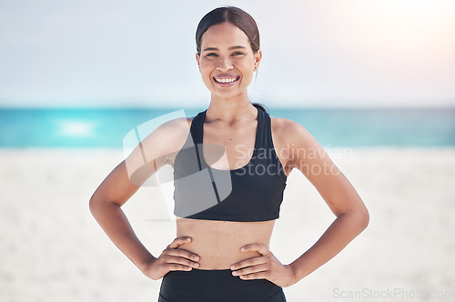 Image of Fitness, portrait and happy woman at a beach for running, workout and sports exercise in nature. Ocean, smile and face of female runner at sea for wellness, health and training routine in Jamaica