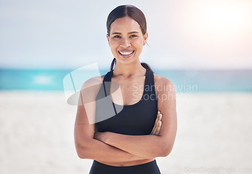 Image of Happy woman, portrait and fitness on beach with arms crossed for professional workout or exercise on mockup. Female person in confidence for outdoor cardio training or healthy body on ocean coast