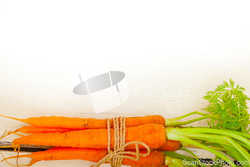 Image of baby carrots bunch tied with rope