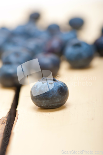 Image of fresh blueberry on white wood table