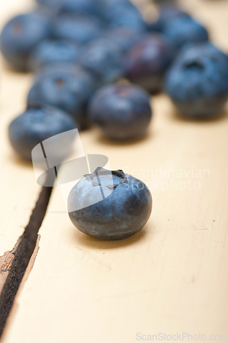 Image of fresh blueberry on white wood table