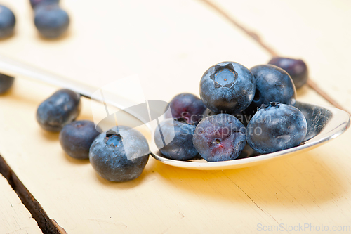 Image of fresh blueberry on silver spoon