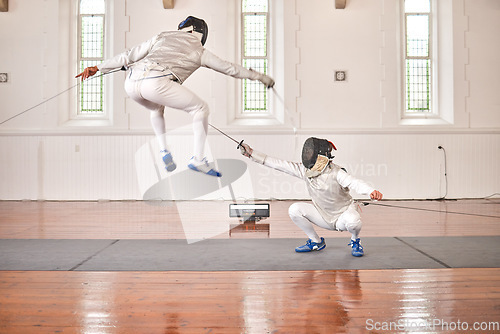 Image of Fencing, sports and people fight, jump and training, fitness or workout for energy with epee sword in gym. Battle, fencer or athlete in performance, competition or exercise with sabre, helmet or suit