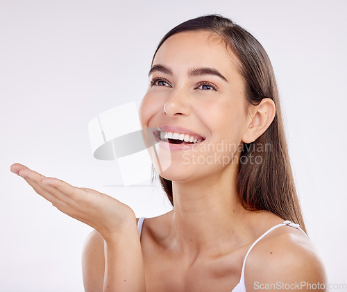 Image of Skincare, advertising and face of woman with palm for wellness, beauty products or cosmetics. Dermatology, mockup and female person with hand gesture for natural health on white background in studio