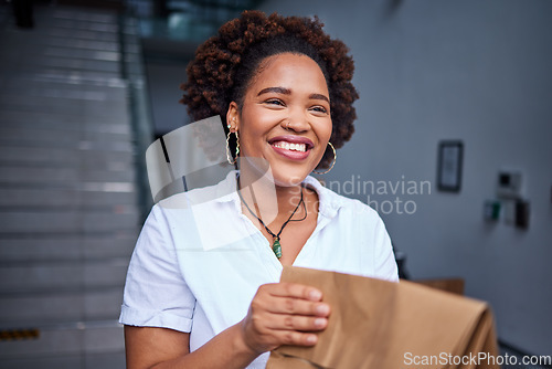 Image of Delivery, happy customer and a woman at a door with a paper bag from courier at home. Face of a person or a client with a package, parcel or fast food from online shopping, e-commerce or service