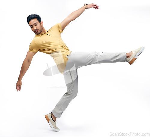 Image of Dance, performance and man balance in studio for freedom, energy and body movement. Creative style, fitness and isolated male person dancing, moving and in action pose for mockup on white background