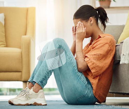 Image of Headache, woman and stress on floor of home with anxiety, depression or ptsd of trauma. Sad girl crying in living room for worry, psychology and pain of mistake, shame and tired of mental health risk